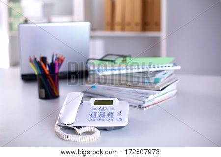 Group of multicolored office folders and glasses.