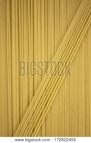 Thin Pasta Arranged In Rows. Yellow Italian Pasta. Long Spaghetti. . Thin Spaghetti. Food Background