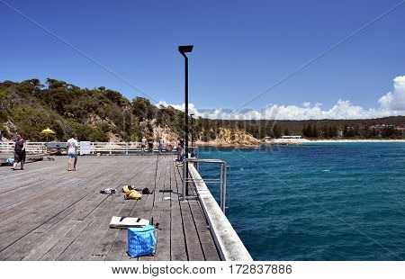 Tathra Australia - Jan 6 2017. Tathra Steamer Wharf. Its historic timbers standing proud and creating a focus for visitors. It is the only remaining sea wharf on the East Coast.