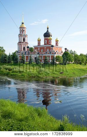 View of Resurrection Cathedral on the river bank Polist in the sunny June afternoon. Staraya Russa, Russia