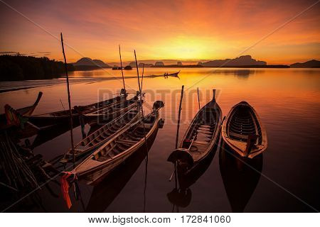 Small boat at the Andaman Sea ( phi phi )at sunset sunrise in Phuket Thailand