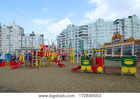 GOMEL BELARUS - APRIL 14 2016: Modern children's playground with bright colorful constructions in residential district on street Khatayevich Gomel Belarus