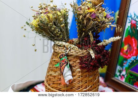 Clay Pot Covered With A Lid And Wheat Sheaf On The Background Fabric Pattern Ukrainian