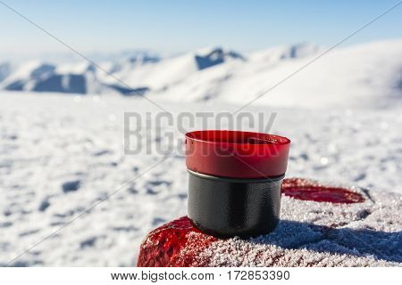 Hot Tea In A Cup From A Thermos On The Table With A Boundary Marker.