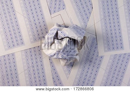 Crumpled Paper Ball On Vintage Classic Answer Sheet. Answer Sheet Concept.