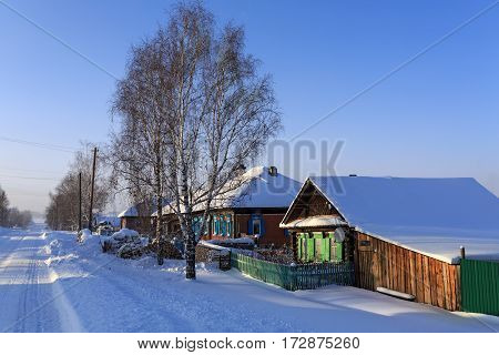 VISIM/ RUSSIA - JANUARY 8. Snow-covered russian old believer village in frosty sunny winter day on January 8, 2015 in village Visim, Ural region, Russia.