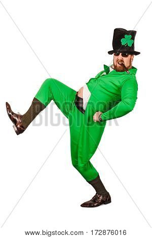 Photo of a man in a Leprechaun costume being silly and smoking a cigar.