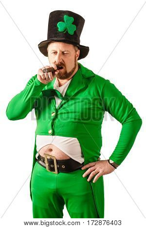 Photo of a man in a Leprechaun costume smoking a cigar.