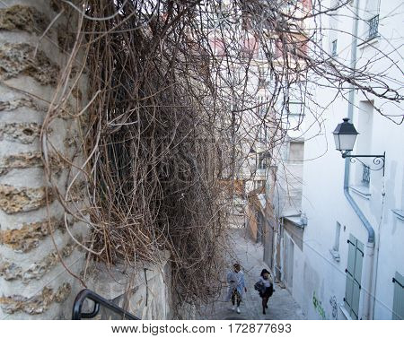 View of typical parisian street on Montmartre hill, Paris, France.