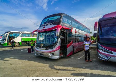 Menumbok,Sabah-Aug 19,2016:A few of bus awaiting the passengers in Menumbok bus terminal,Sabah.People used to take bus from Kota Kinabalu to Menumbok,Sabah then ferry to Labuan island.