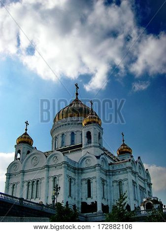 Golden domes of the Cathedral of Christ the Savior against the blue sky. Summer, Moscow, Russia