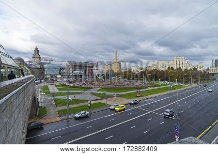 MOSCOW RUSSIA - OCTOBER 15 2016: View of Square of Europe and Kiyevsky railway terminal from a pedestrian bridge across the Moscow River. October cloudy.