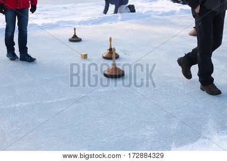 People Playing Curling On A Frozen Lake, Austria, Europe