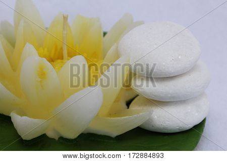 spa stil llife with lily candle,zen stone on the white background