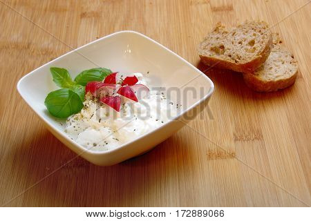 cottage cheese in a bowl bread plate