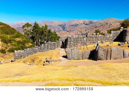 Inca Ruins - Saqsaywaman Peru South America. Archaeological complex Cuzco. Example of polygonal masonry 12 sided Hatunrumiyoc stone