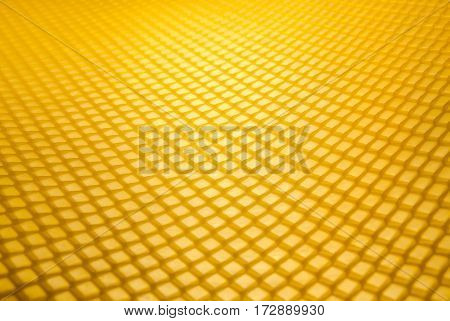 Empty honeycomb grid in perspective, brand- new beeswax, background texture