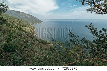 Mountain and sea. Nature composition. Wildlife Reserve Baikal. Hiking in the small mountain ranges. Lake View from a height.