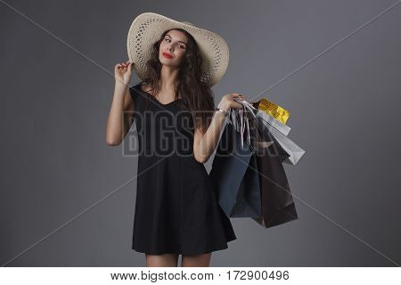 Beautiful woman with shopping bags. Studio shoot