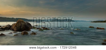 A rocky moss covered coastline looking out over the south China sea in Vung Lam Bay Vietnam.
