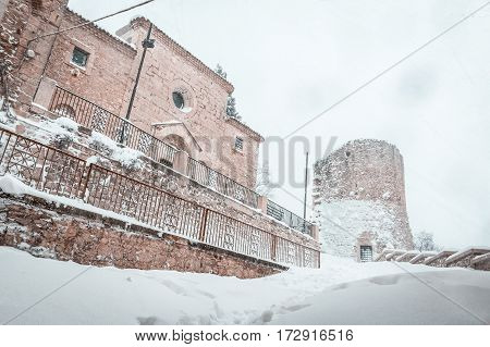 the snowy church and tower in Campobasso