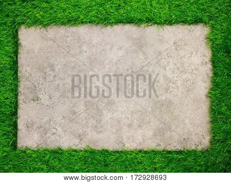 Square concrete plate on artificial green grass background