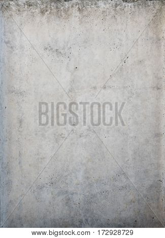 Concrete grey wall texture background with cracks and holes