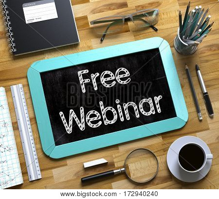 Small Chalkboard with Free Webinar. Free Webinar Handwritten on Mint Chalkboard. Top View Composition with Small Chalkboard on Working Table with Office Supplies Around. 3d Rendering.