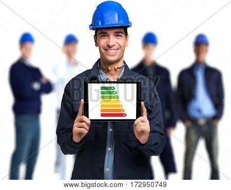 Engineer showing a power efficiency rating scale on a tablet