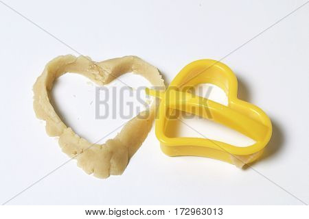 Preparation Of Baking Cookies At Home. On The Countertop Dough Is In The Form Of Heart And A Plastic