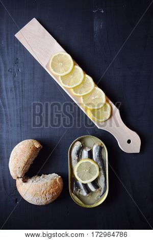 metal can with conserved herring fish, canned marinated herring,  open tin can , Top view.