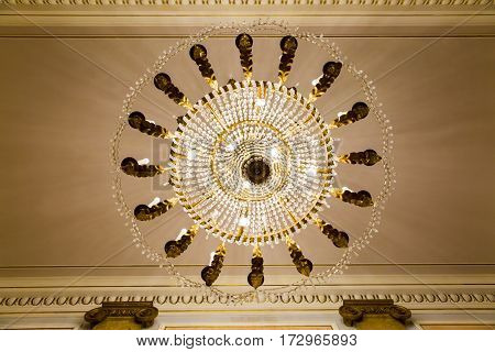 below view from ancient classic Murano glass crystal chandelier lighted