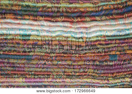 Background of Oriental cashmere stoles folded stack