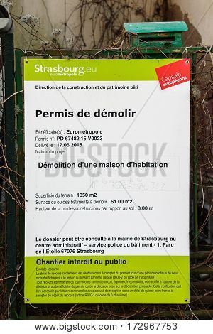 STRASBOURG FRANCE - APR 10 2016: House demolition permit issued by city hall on the wall of a house with the question added by neighobours ; Why? And what about the memory of the neighborhood of Robertsau?