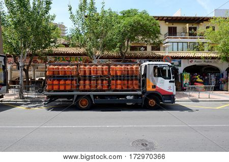 MALLORCA SPAIN - MAY 29: The track with Repsol propane bottled gas is on street on May 29 2015 in Mallorca Spain. Up to 60 mln tourists is expected to visit Spain in year 2015.