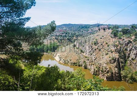 Tajo -- largest river in the Iberian Peninsula. Originates in Spain and flows into the Atlantic ocean near Lisbon. The city of Toledo in Spain (the Ancient capital of Spain). May 2006