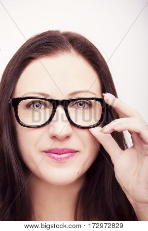 Beautiful young woman wearing glasses close-up isolated on white background.