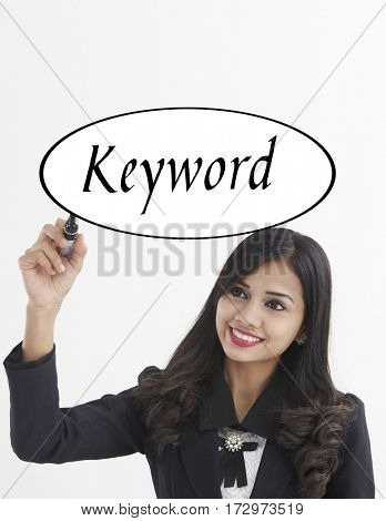 businesswoman holding a marker pen writing -keyword