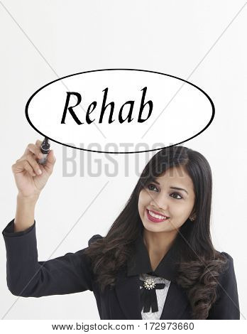 businesswoman holding a marker pen writing -rehab