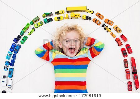 Little Boy Playing With Toy Cars. Toys For Kids.