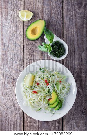 Spicy kohlrabi noodles, dressing: fish sauce, vinegar rices, lime garlic and ginger