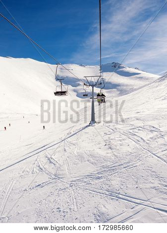 Kalavrita Greece - January 28 2017:View from the lift of Kalavrita ski resort with people on the slopes in a sunny day