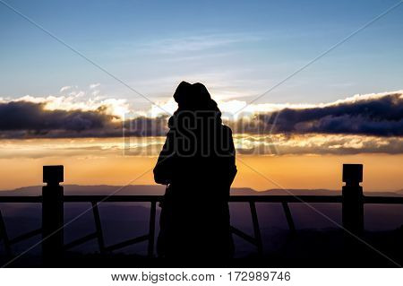 Silhouette Of A Beautiful Woman Standing On Panoramic Viewpoint., Looking To The Horizon And Enjoyin