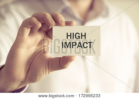 Businessman Holding High Impact Message Card