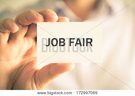 Businessman Holding Job Fair Message Card