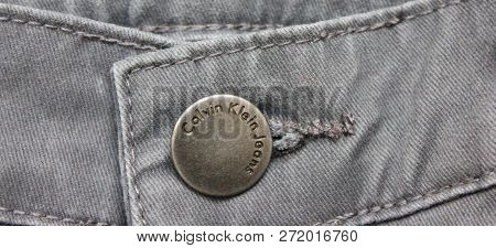 Moscow, Russia - November 5, 2018: Gray Calvin Klein Jeans (ck) Front View. Waistband Garment Close 