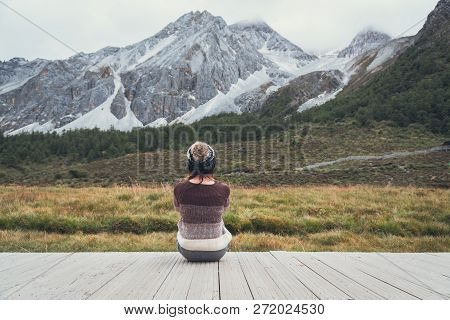 Young Woman Traveler Sitting And Looking Beautiful Landscape And Feeling Lonely, Travel Lifestyle Co