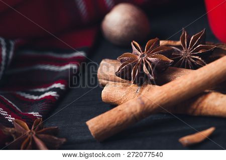 Anise Star Spices And Cinnamon Sticks On Dark Rystic Wooden Background