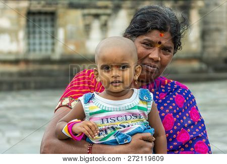 Belur, Karnataka, India - November 2, 2013: Chennakeshava Temple. Closeup Of Grandmother Holds Cerem