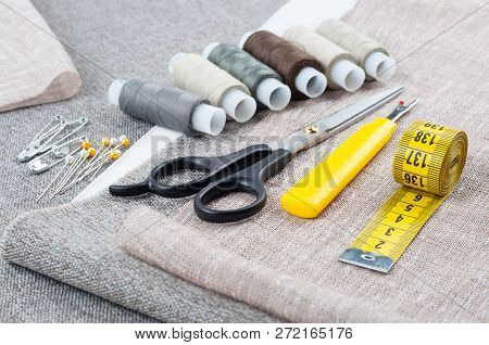 Sewing Pattern Composition With Scissors, Spools Of Thread, Pins, Measuring Tape